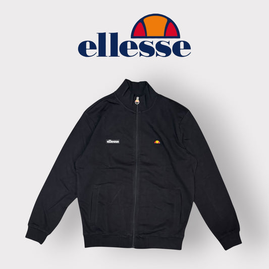 ELLESSE - Felpa Uomo con logo ricamato lato cuore, con colletto e zip, Col.Nero