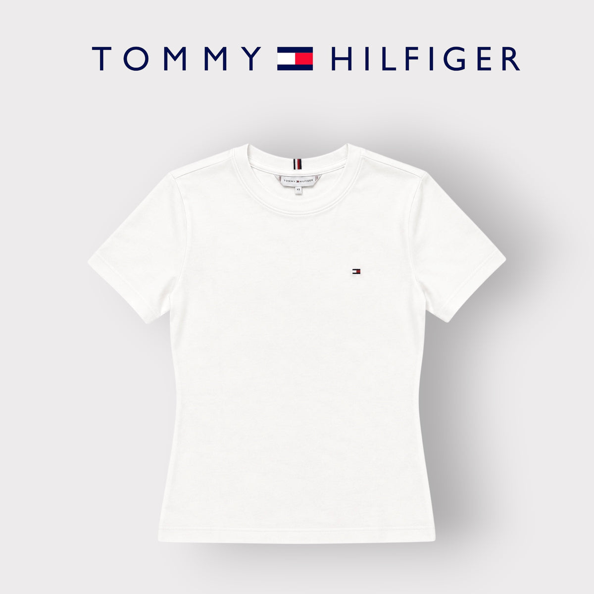 TOMMY HILFIGER- T-shirt Donna, con logo ricamato lato cuore, Slim Fit, col.Bianco